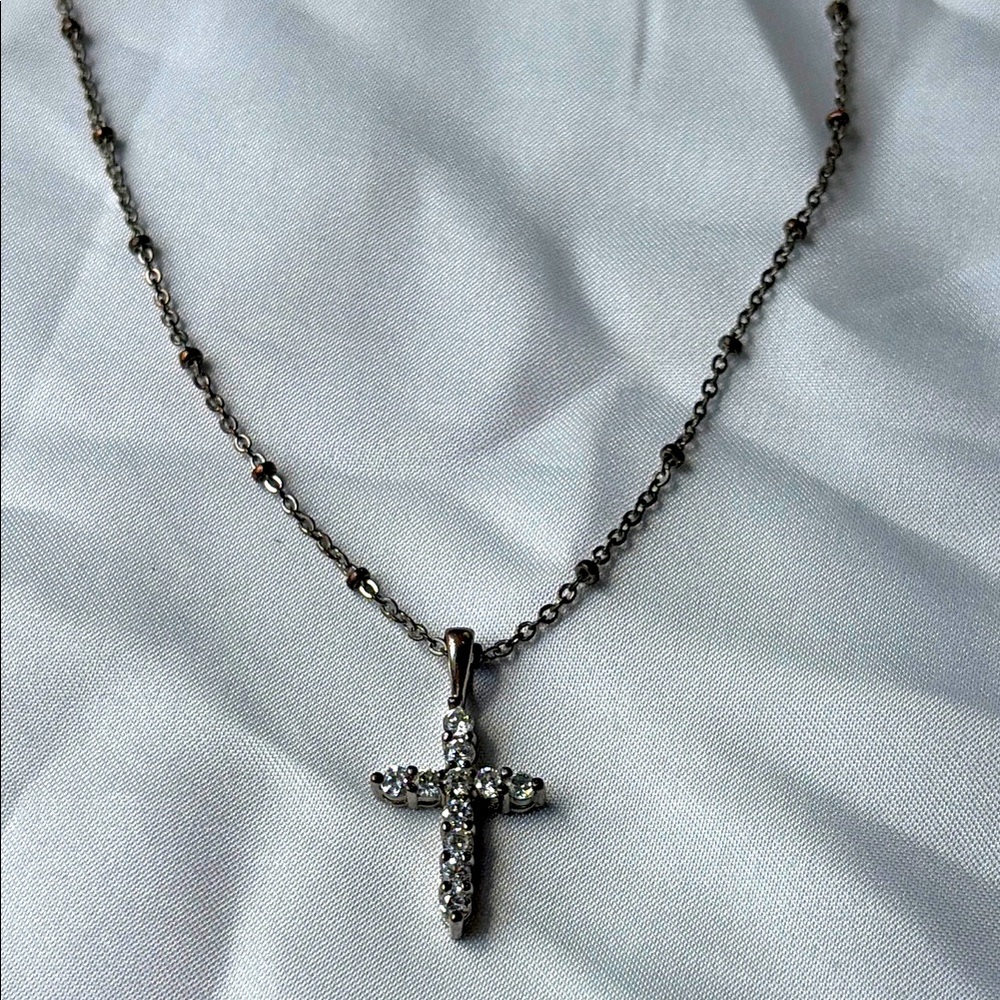 Faux diamond cross necklace by Vicky Jousan.